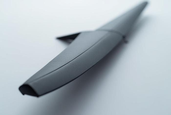 Sleek, finished carbon fiber UAV wing, showcasing advanced composite design